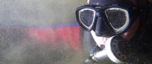 A British cave diver in a silty sump