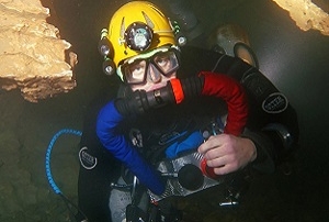 A British cave diver using a custom built chest-mount rebreather