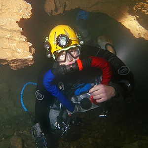 A British cave diver using a custom built chest-mount rebreather